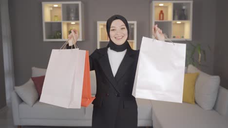 muslim woman in hijab with shopping bags.