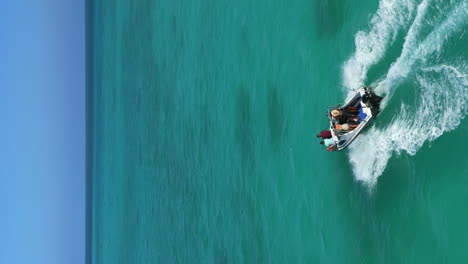 power boat speeds across ocean near isle of pines