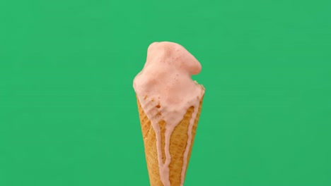 Time lapse of melting ice cream cone on green background, 4K