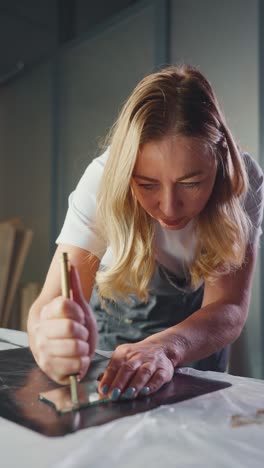 woman working on a mirror