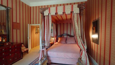 slow revealing shot of an antique-designed bedroom within the