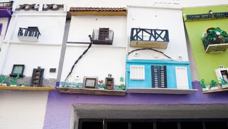 miniature houses decorated on a wall