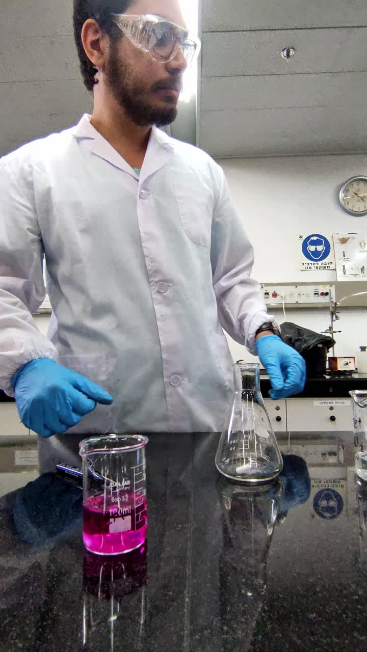 Middle Eastern Scientist Conducting Chemical Work