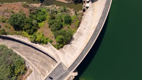 Flying-Above-Concrete-Wall-Of-Belesar-Dam-On-Minho-River-In-Lugo,-Spain