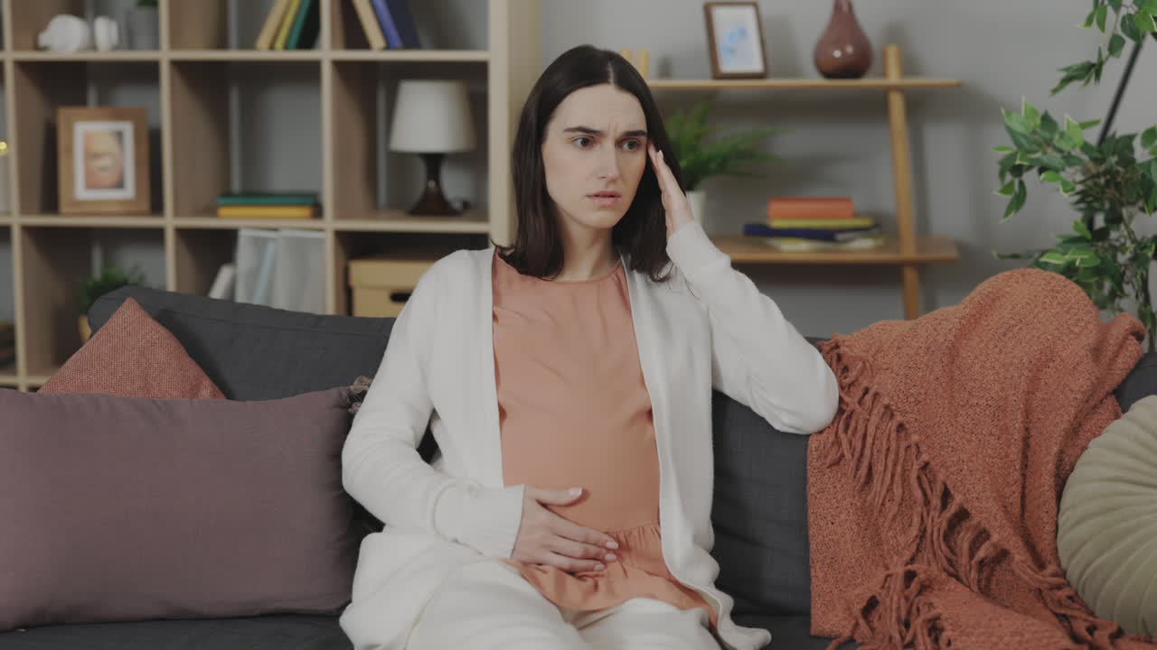 Pregnant woman experiencing pain