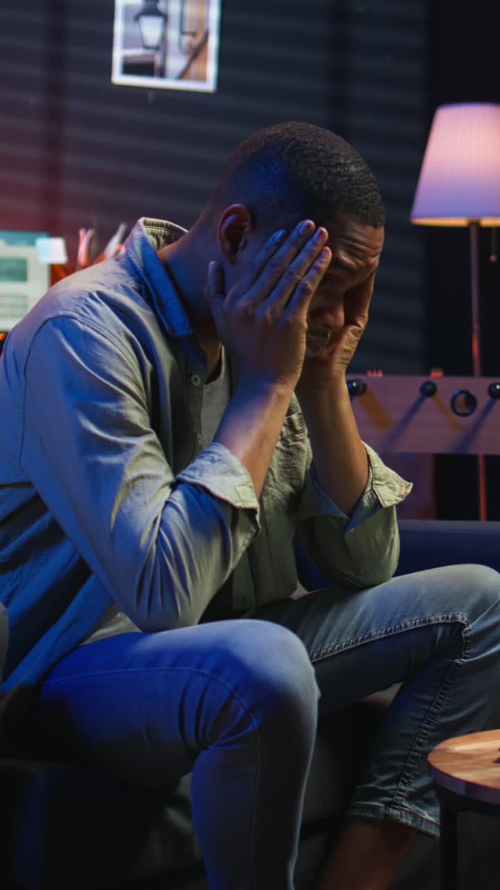 Vertical Video Stressed young adult fearing failure and struggling with deadlines