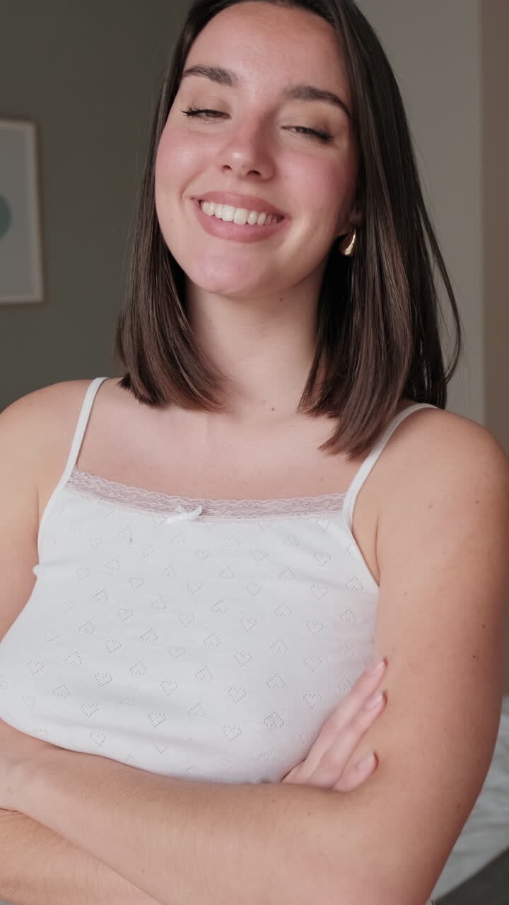 Portrait of Happy Woman Smiling in Her Bedroom