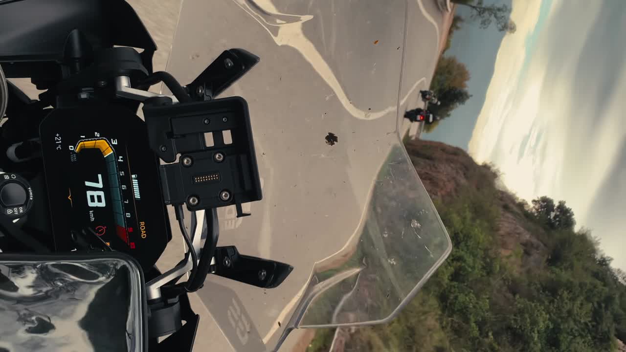Onboard shot of motorcycle riders on mountain road on the way to Montserrat Monastery in the Spanish countryside. BMW R1250GS
