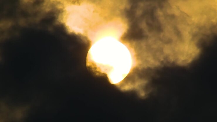 Glowing full moon behind fast moving dark clouds, concept scary night