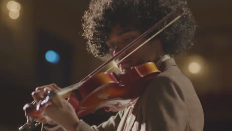 young african american violinist giving concert