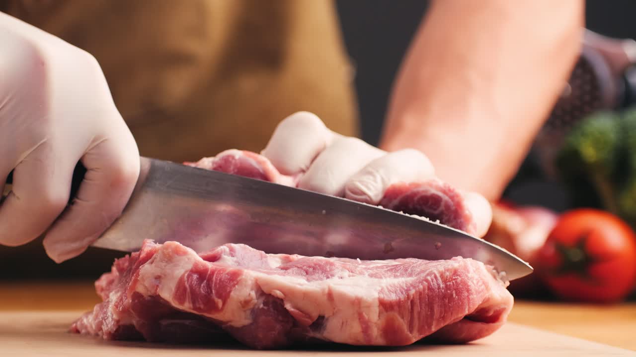 Chef preparing raw pork