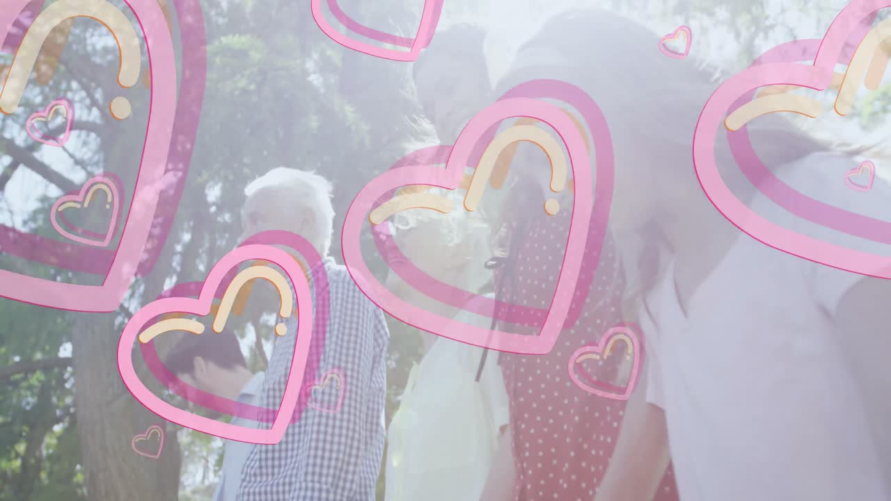 밖의 백인 가족 위에 실패하는 심장 모양의 애니메이션