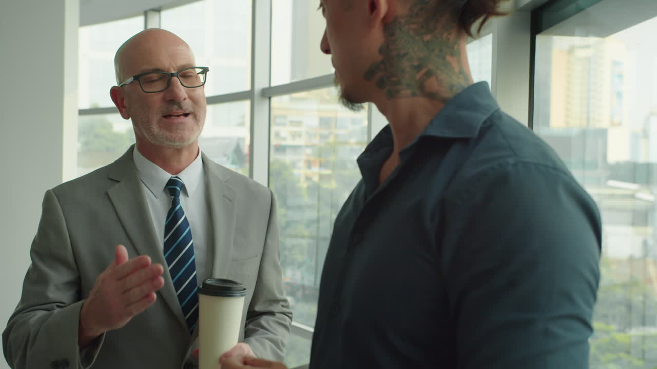 Businessman Talking to Manager during Coffee Break