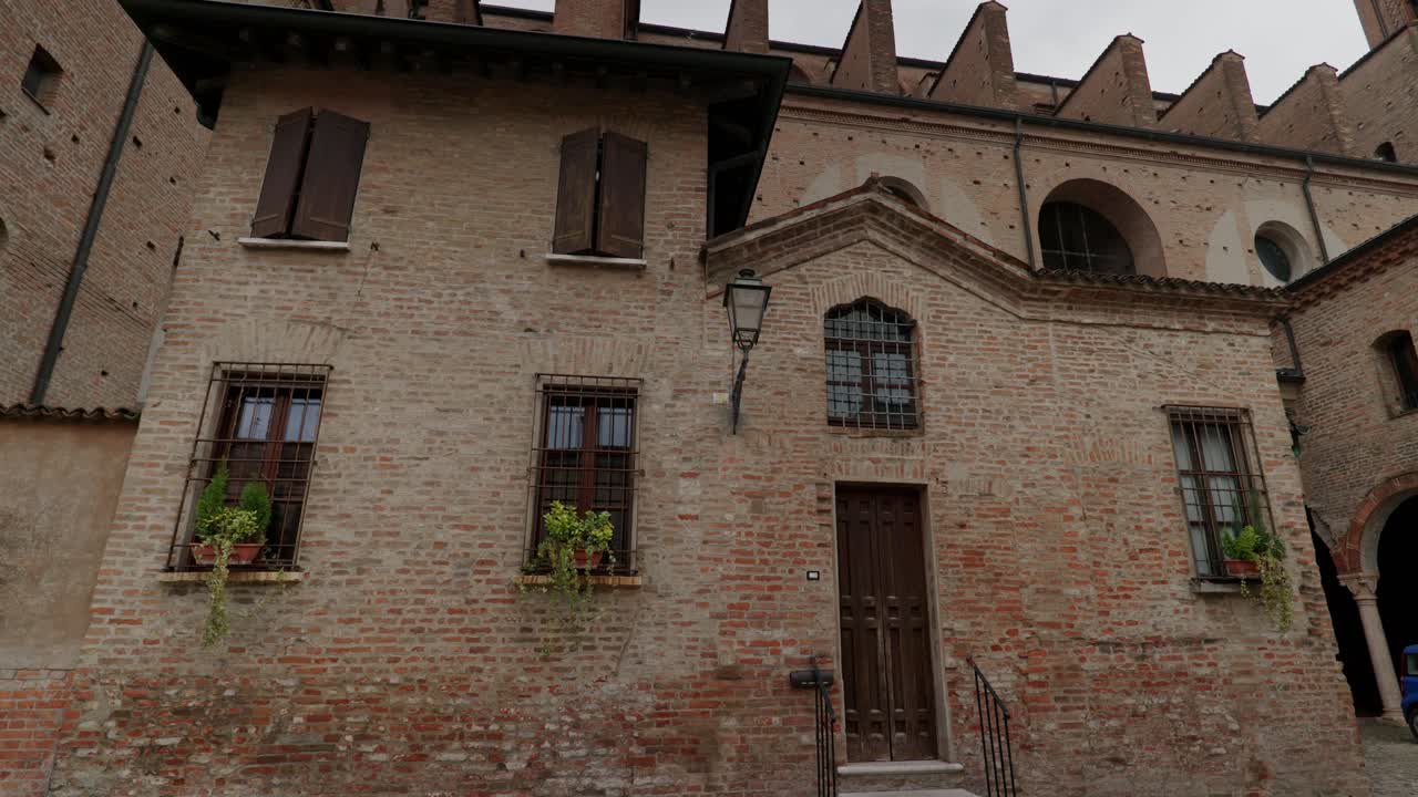 Antique Brick Walls Of Historic Building In Verona, Italy. Low Angle