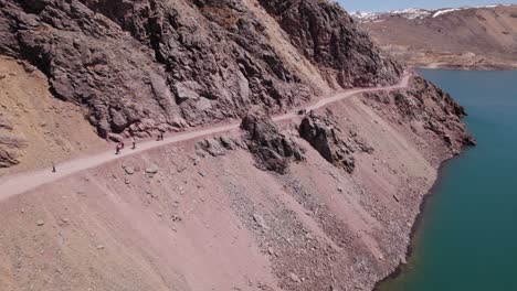 People-Walking-On-The-Trail-At-El-Yeso-Dam-In-Andes,-Santiago,-Chile