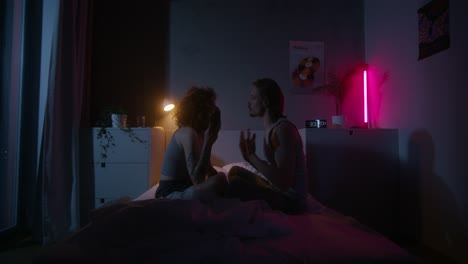 couple talking in bed at night