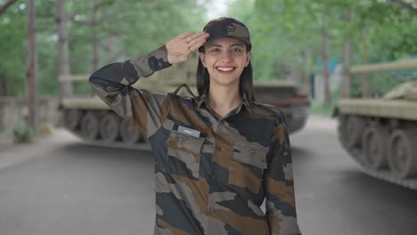 happy indian woman army officer saluting