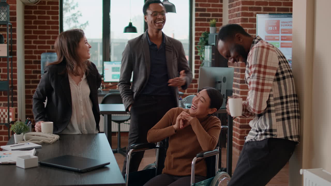 Diverse group of people laughing and having fun on work break