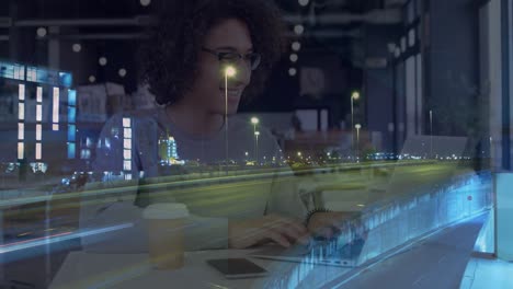 animation of smiling woman using laptop in cafe, over sped up traffic in city at night
