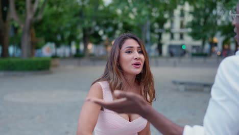a couple having a heated argument in a park