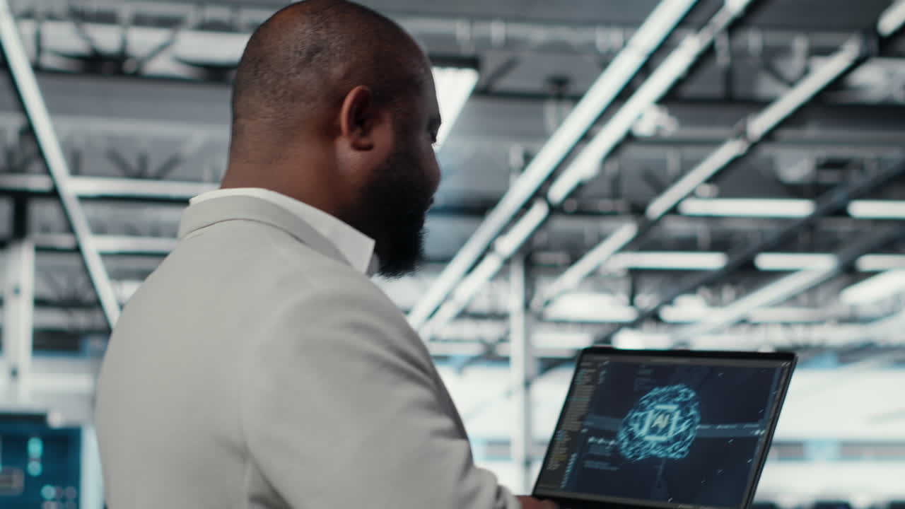 Vertical video Data center admin doing IT maintenance tasks using AI technology