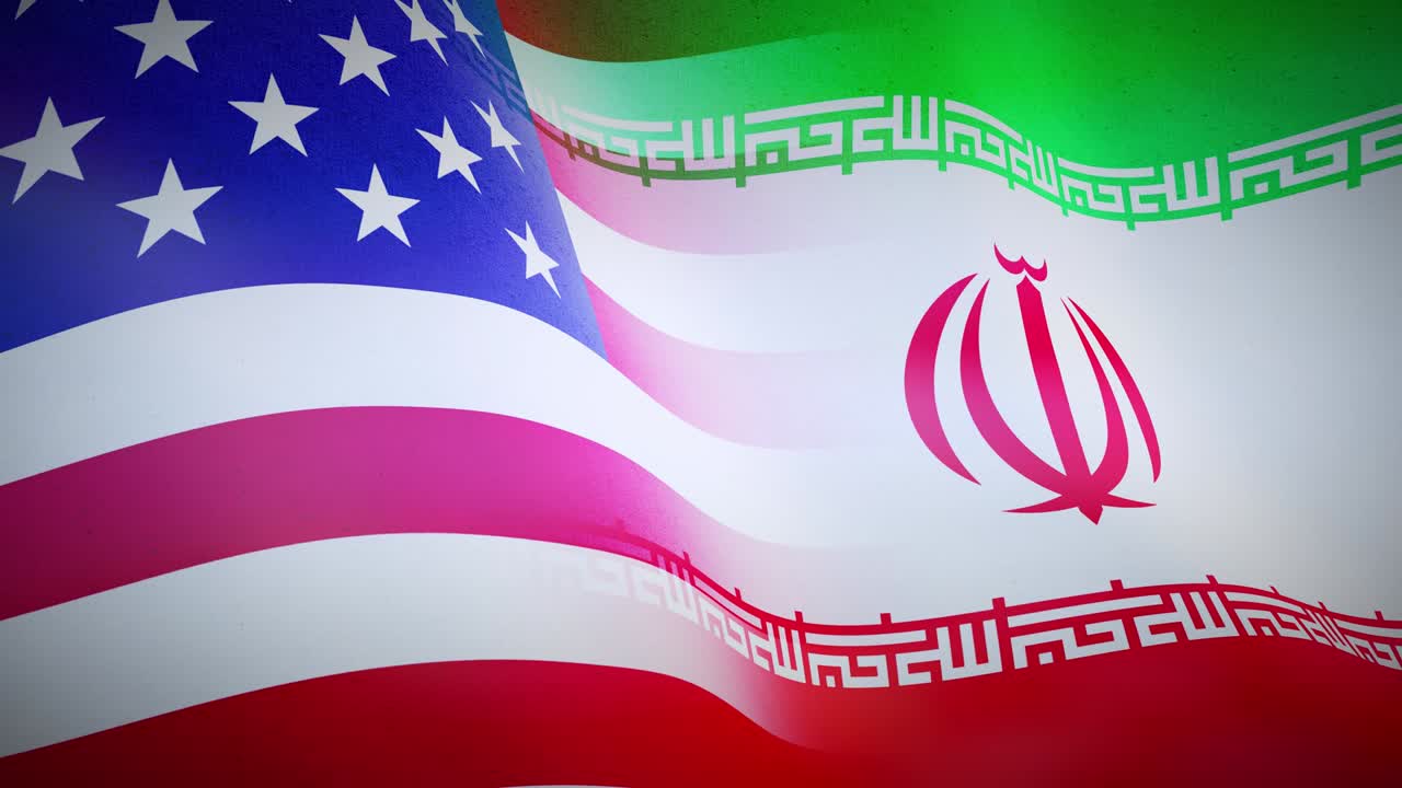 Iranian and United States American flags showing government aggression and disagreement.