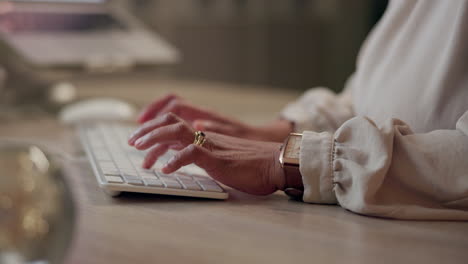hands typing on a keyboard