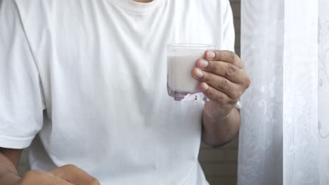 person drinking milk or yogurt