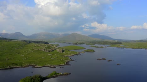 derryclare lough, connemara, county galway, july 2021. drone gradually tracks south across the lake, while facing east with the twelve bens mountains in the distance