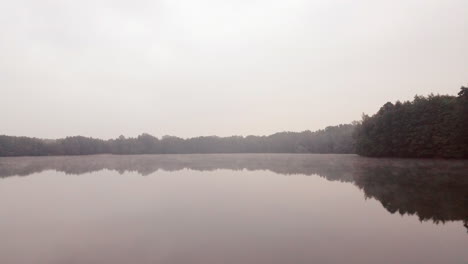 beautiful lake on a foggy morning