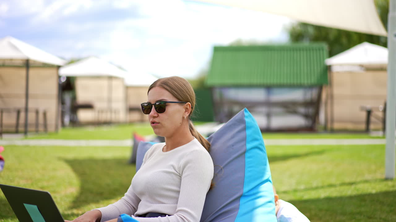 Woman Working Outdoors with Laptop