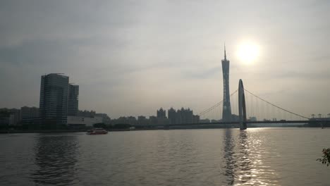 sunset time guangzhou city famous bridge canton tower riverside slow motion panorama 4k china