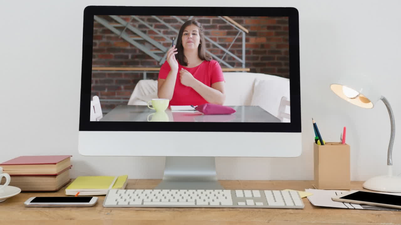 Animation of female vlogger recording vlog at home on computer screen on desk at home