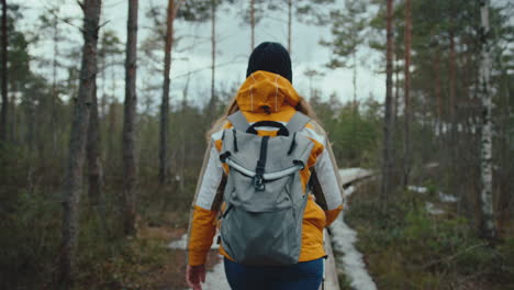 Woman-walking-in-the-forest