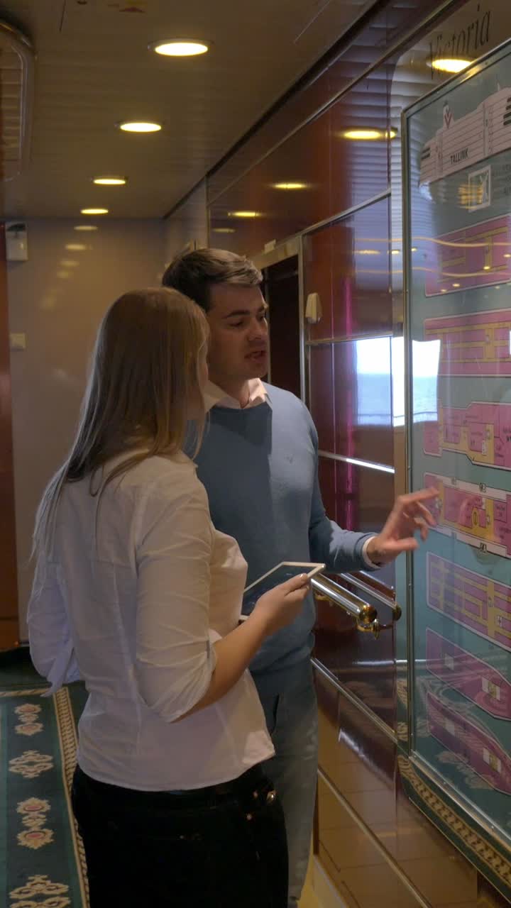 People looking at a floor plan