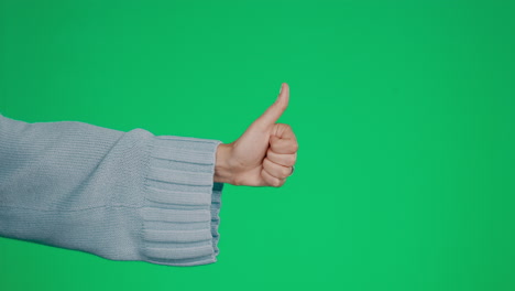 hand, thumbs up and approval on a green screen