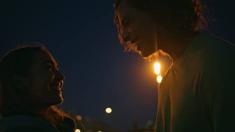 couple kissing at night