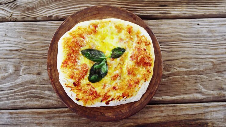 Baked pizza on wooden board