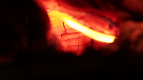 wooden log burning at very high temperatures, very close up view