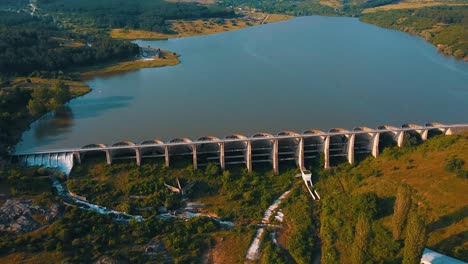 big dam creating a huge lake used for irrigation and agriculture drone shot