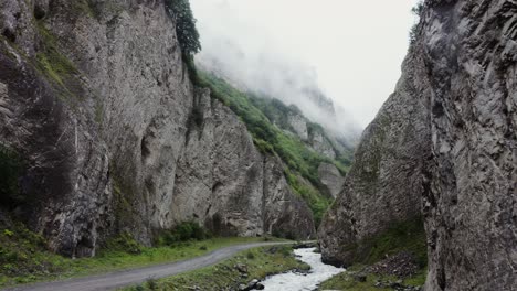 misty mountain valley with river and road