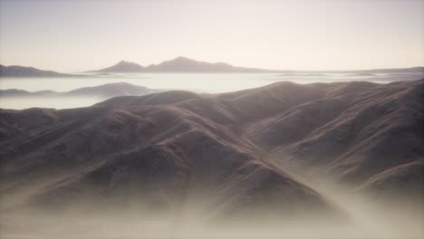 mountain landscape with deep fog at morning