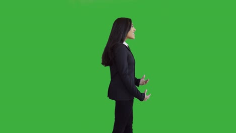 lifestyle portrait of young african american business woman isolated on green screen chroma key background