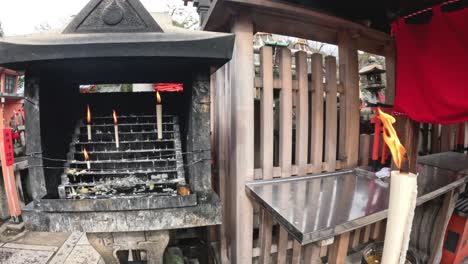 sequential lighting of candles in a shrine