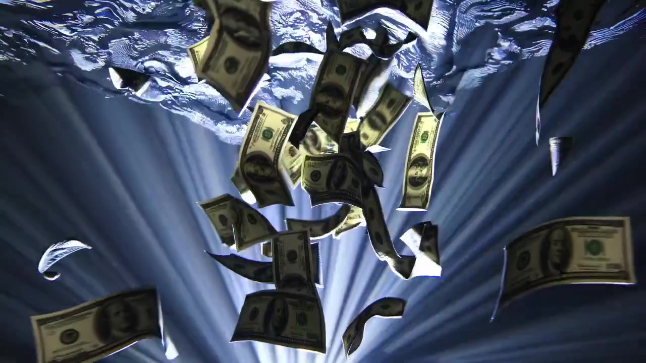 Banconote di dollari statunitensi che affondano sott'acqua con raggi di luce