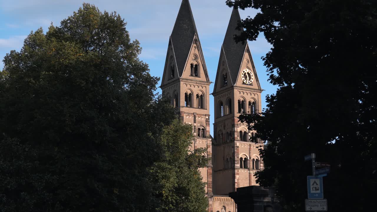 The historic Basilica of St. Castor, the oldest preserved church in Koblenz, Germany, prominently featuring its twin Romanesque western towers