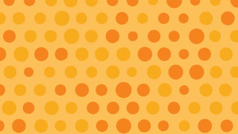 los puntos de polca se mueven sobre un fondo naranja.