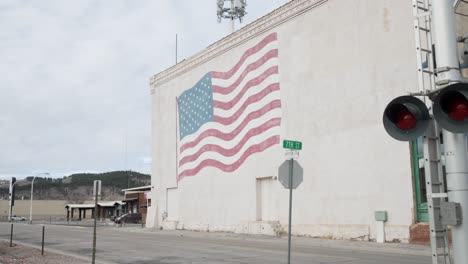 a painting of the united states flag on a building in downtown rapid city, sd