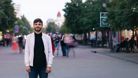 man standing on a city street