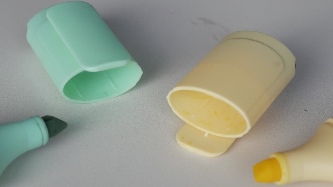 Pastel markers on white surface, soft focus, creative concept